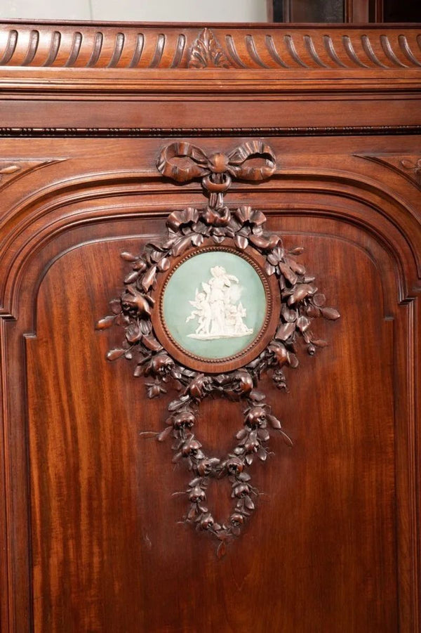 Late 19th Century Monumental French Carved Walnut Cabinet with Wedgwood Plaques