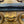 Load image into Gallery viewer, 19th C. Carved Rococo-Style Black and Gold Mirror with Painted Hanging Garlands