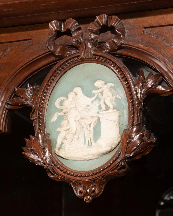 Late 19th Century Monumental French Carved Walnut Cabinet with Wedgwood Plaques