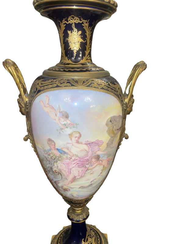 Pair of 19th Century French Sèvres Porcelain Urns with Ormolu Mounts