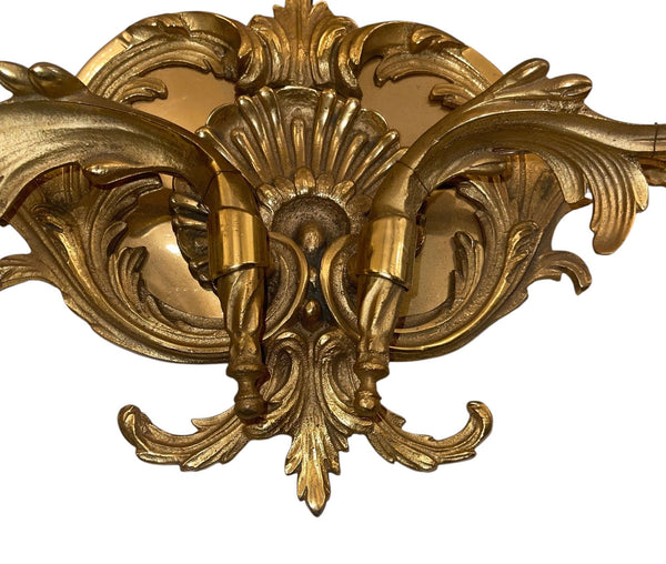 Pair of French Gilt Bronze Louis XV Style Two-Light Wall Sconces. 20th Century.