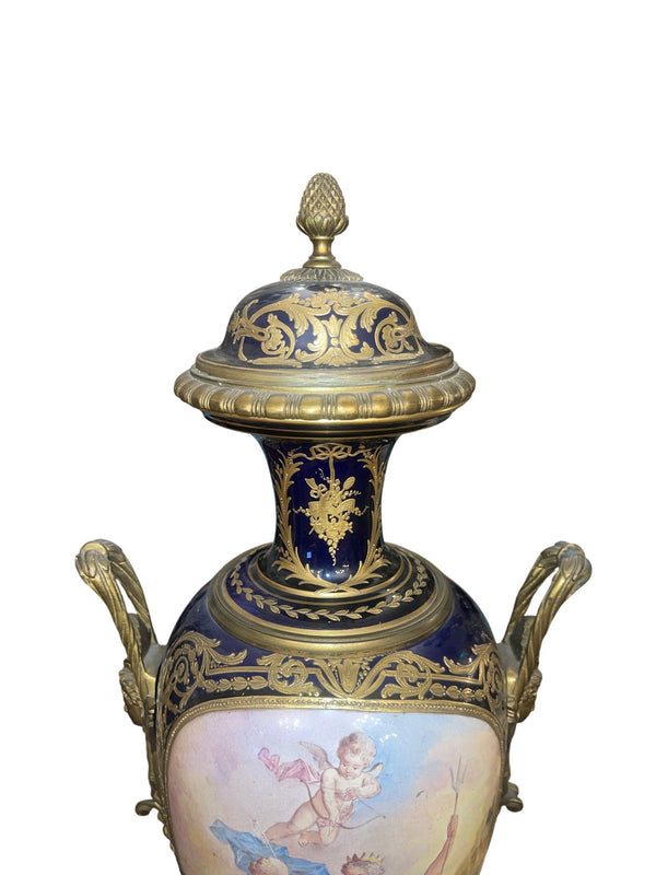Pair of 19th Century French Sèvres Porcelain Urns with Ormolu Mounts