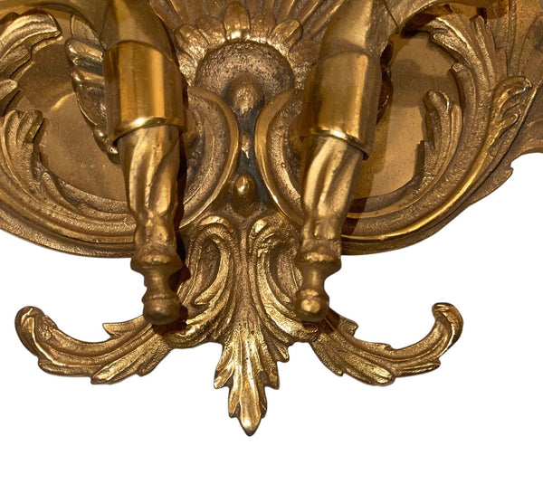 Pair of French Gilt Bronze Louis XV Style Two-Light Wall Sconces. 20th Century.
