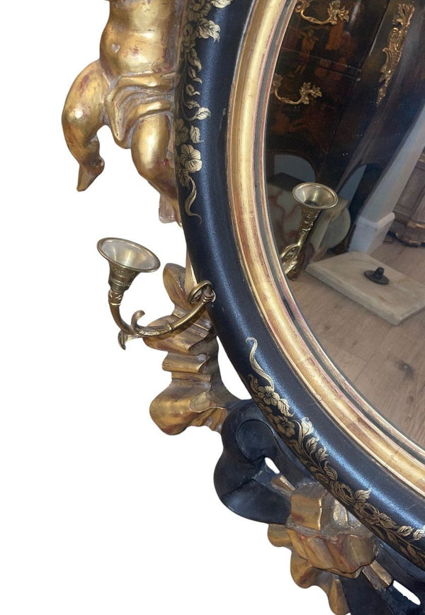 Italian 20th C. Rococo Style Ebonized & Giltwood Mirror w/ Putti & Candle Arms