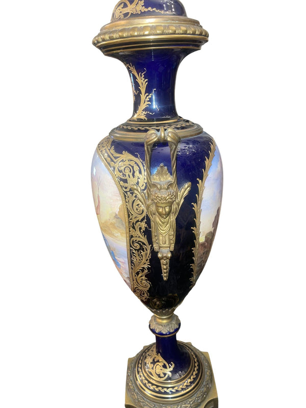 Pair of 19th Century French Sèvres Porcelain Urns with Ormolu Mounts