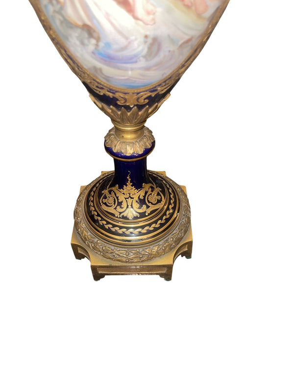 Pair of 19th Century French Sèvres Porcelain Urns with Ormolu Mounts
