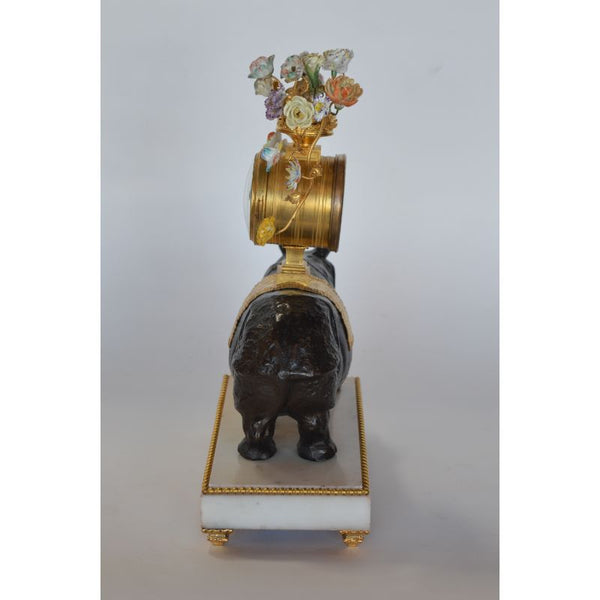 French Late 19th Century Gilt Bronze and Dark Patina Rhino Clock with Porcelain Flowering