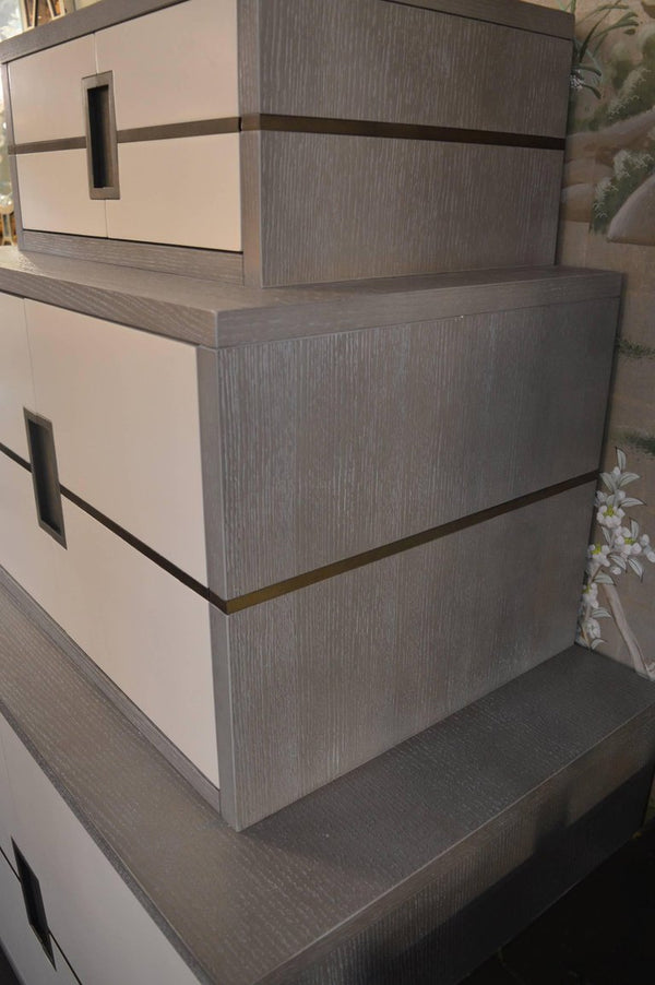 Stacked Grey and White cabinet with Brass